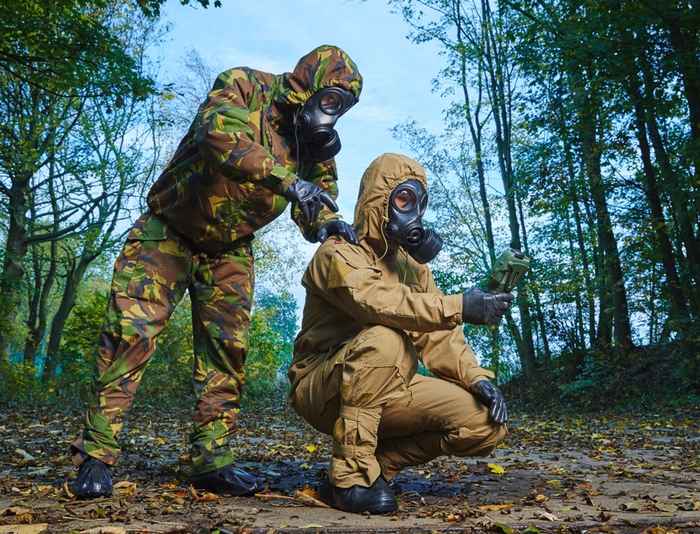 Image of two military people with an instrument to detect chemical warfare agents
